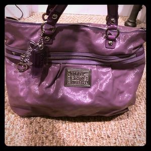 Lavender Coach tote bag.